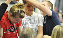 Students work to untie a "human knot" at a Captains Clinic Captains-clinic-09.jpg