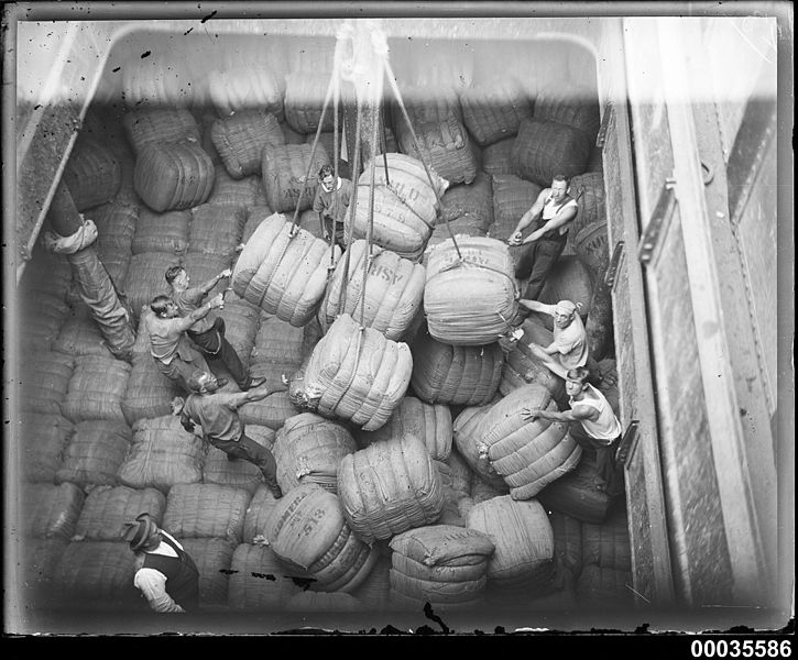 File:Cargo hold in MAGDALENE VINNEN with crew men positioning wool bales, March 1933 (6958570450).jpg