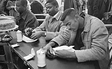 Student sit-in at Woolworth in Durham, North Carolina on February 10, 1960. Civil Rights protesters and Woolworth's Sit-In, Durham, NC, 10 February 1960. From the N&O Negative Collection, State Archives of North Carolina, Raleigh, NC. Photos taken by The News & (24495308926).jpg