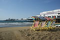 Deckchairs out on Sandown beach, Isle of Wight on a Summer morning. The pier can be seen in the background.