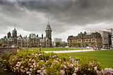 Exterior view of grounds in front of the Centre Block, with the East Block and Langevin Block in the image