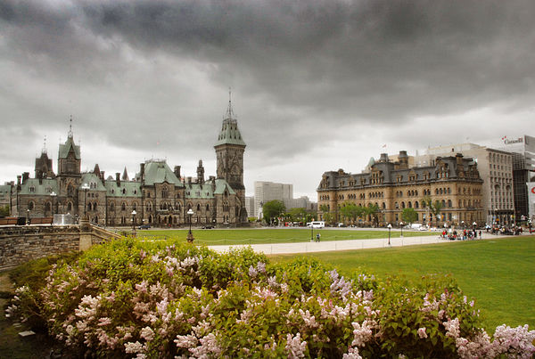 Downtown Ottawa is dominated by government buildings such as Parliament Hill (left) and The Office of the Prime Minister and Privy Council (right).