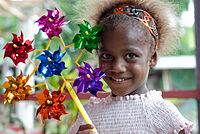 A child with pinwheels