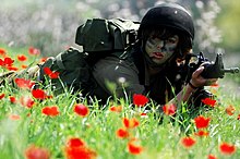 A female soldier of the IDF Search and Rescue Unit. Flickr - Israel Defense Forces - Guns N' Roses, Welcome to the Home Front Jungle.jpg