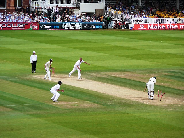 Andrew Flintoff takes his fifth wicket of the match, knocking out Peter Siddle's middle stump to help England beat Australia in the Second Test.