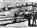 Four gentlemen inspect the Fassifern District Exhibit which won first prize at the Brisbane Exhibition, 1912 (7642255074).jpg