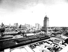 The skyline of Downtown Miami with the Florida East Coast Railway passenger train station and the Dade County Courthouse in the foreground, c. 1930s GovernmentCtr1930s.jpg