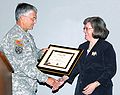 Army Chief of Staff Gen. George W. Casey Jr. presents a Freedom Team Salute Commendation to Holly Petraeus, wife of Gen. David H. Petraeus
