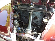 The horizontally opposed engine is very low immediately behind the grille and in front of the radiator Javelin engine bay Where%3F (9018429652).jpg