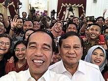 Prabowo Subianto and Indonesian President Joko Widodo on 11 October 2019 Jokowi selfie with Prabowo and reporters.jpg