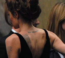 Jolie at the premiere of A Mighty Heart in 2007; several of her tattoos are visible