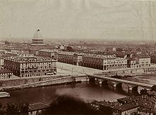A view of Turin in the late 19th century. In the background, the Mole Antonelliana under construction. Maggi, Giovanni Battista - Torino - Panorama.jpg