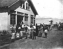 Manzanar Community Hall, ca. 1912. In back is Hatfield's (later Bandhauer's) General Store, which housed the post office. ManzanarCommunityHall.jpg