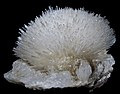 Image 20Natrolite is a mineral series in the zeolite group; this sample has a very prominent acicular crystal habit. (from Mineral)