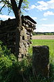 Čeština: Starý kamenný plotový sloup v Rozích, okr. Třebíč. English: Old stone fence pole in Rohy, Třebíč District.
