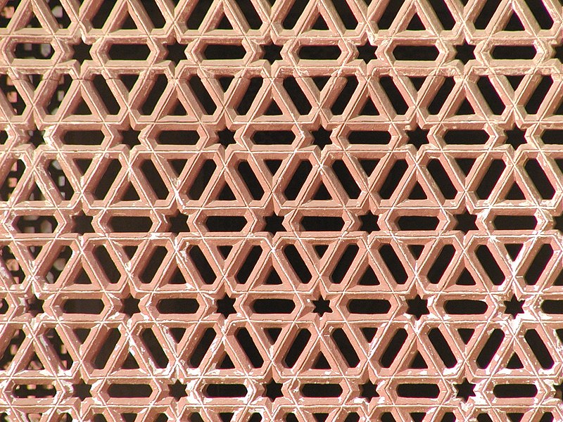 File:Red sandstone Lattice piercework, Qutb Minar complex.jpg