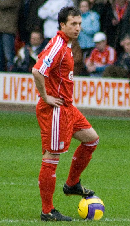 A man who plays football for Liverpool F.C., just before kick-off