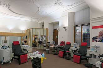 Blood donation center at the University Hospital of Basel, Switzerland. From left to right: Two cell separators for apheresis, secluded office for pre-donation blood pressure measurement and blood count, and on the right, chairs for whole blood donations. Saal Blutspendezentrum Basel 3.jpg