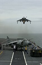 Sea Harrier FA2 of 801 Naval Air Squadron on HMS Illustrious (R06) in June 2001 Sea Harrier FA2 801 NAS hovers over HMS Illustrious (R06) 2001.jpeg