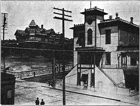 English: "Katzenjammer Castle"—Seattle's city hall in the years after the Great Fire of 1899—and, at left, Henry Yesler's mansion, the public library until it burned in 1901.