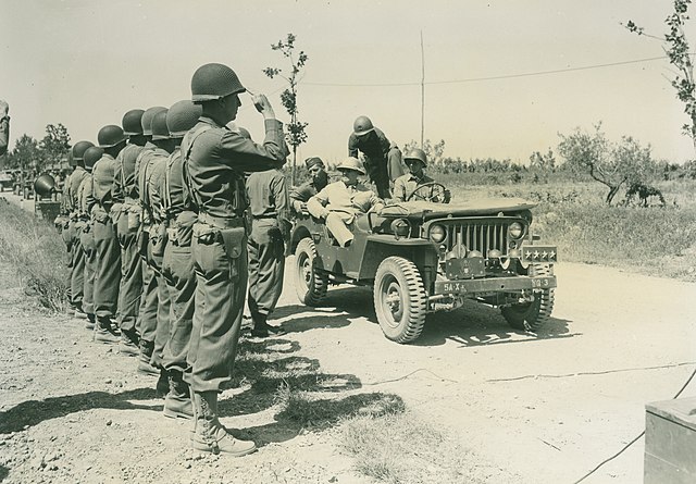 Secretary of War Henry L. Stimson and Lieutenant General Mark W. Clark, commanding the U.S. Fifth Army, and Major General Charles W. Ryder, commander 