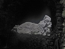 The statue of a sleeping nymph in a grotto at Stourhead gardens, England. Stourhead, Grotto, statue of a sleeping nymph.jpg