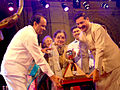 Singer Sulochana Chavan (center) receives award from Ajit Pawar.