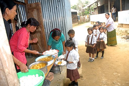 The Children being served the food under the Mid-day Meal Scheme at a primary school, Wokha district in Nagaland.jpg