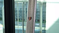 The embossed heart design on one of the trains stanchions