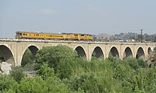 The Santa Ana River Viaduct UP business train on Santa Ana River Viaduct, May 2013 (cropped).jpg