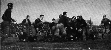 In the early 20th century, some players wore helmets but they were not mandatory. 1909 Michigan-Minnesota.png