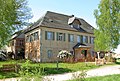 Manor house of a former farm with a later extension (children's home)