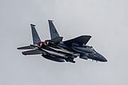 An F-15E Strike Eagle, tail number 97-0218, taking off from RAF Lakenheath in England. The aircraft is assigned to the 492nd Fighter Squadron.