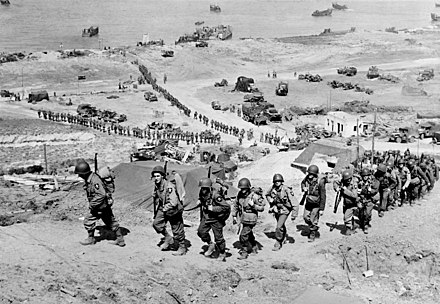 US Army 2nd Infantry Division marching up the bluff at Omaha Beach, on D+1, June 7, 1944