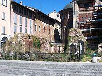 Close-up of remains with a plaque showing its original form