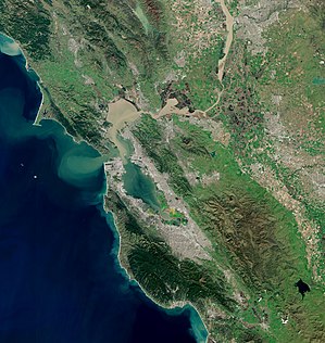 Satellite photo of the San Francisco Bay Area. The San Francisco peninsula protrudes northward. San Francisco is at its tip. Bay Area by Sentinel-2, 2019-03-11 (small version).jpg