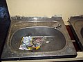 Broken, waterless, abused hand basin with marijuana - dagga but from girls toilets in a Soweto High School (6662192165).jpg