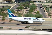 A WestJet Boeing 737-700 at Phoenix Sky Harbor International Airport, October 2004. WestJet introduced flights to Phoenix and other U.S. cities in 2004.