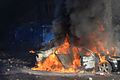 Car put on fire in the barricade line as clashes in Kyiv, Ukraine. Events of February 18, 2014