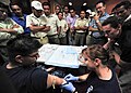 Defense.gov News Photo 110719-N-QD416-045 - U.S. Navy Lt. Cmdr. Rebecca Pate right demonstrates how to insert an IV during a trauma care subject matter expert exchange at Universidad Modular.jpg