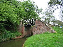 A split bridge spanning the canal near Turners Green. The towpath ran beside the bridge, rather than beneath it, and the towrope was passed through the slot.