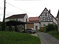 Residential stable house and three side buildings of a four-sided courtyard