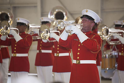 The U.S. Marine Drum and Bugle Corps performing shown performing a stationary concert feature.