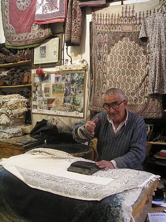 An old master of hand-printed carpets in Isfahan bazaar