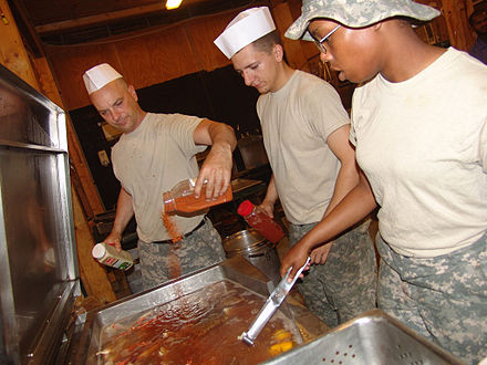 Soldiers preparing a crab boil at Forward Operating Base Mahmudiyah, Iraq