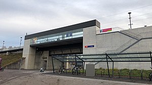 Concrete bridge with glassed-in waiting area