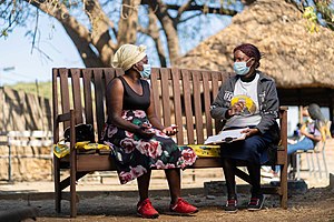 Friendship Bench Ambuya Utano (Community Grandmother) having a problem-solving therapy session on the Friendship Bench in Harare, Zimbabwe Friendship-Bench-Zimbabwe.jpg