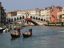 Venice: "Flat water before me, / and the trees growing in water, / Marble trunks out of stillness, / On past the palazzi, / in the stillness, The light now, not of the sun" (Canto XVII) Gondola.arp.750pix.jpg