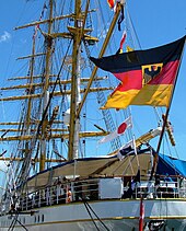 Stern view of Gorch Fock, showing the German naval ensign and the ship's rigging. Gorch-Fock HFX 2007.jpg
