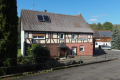 English: Half-timbered building in Heisters Am Steinhuegel 1, Heisters, Grebenhain, Hesse, Germany This is a picture of the Hessian Kulturdenkmal (cultural monument) with the ID Unknown? (Wikidata)